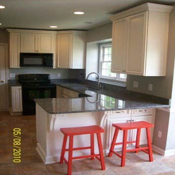TRIANGLE HOME SOLUTIONS kitchen renovation This beautiful kitchen renovation in Cary, NC included cabinet installation, granite counter tops, vinyl flo