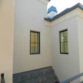 4-coat Stucco in Cupertino New 4-coat stucco on custom new construction home in Cupertino featuring Benjamin Moore 'Annapolis Grey'.
