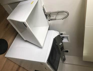 New laundry area complete with wall hung sink