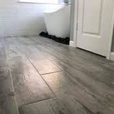 Tile hardwood floor in bathroom