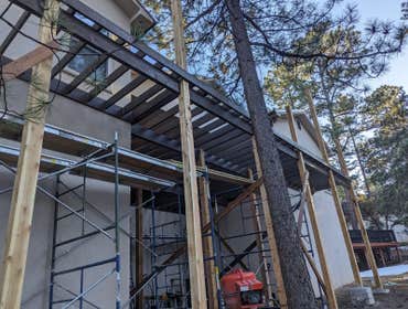 Photos by High Altitude General Contractors / H. A. G. C #6 Trex Deck with Cedar post going up!