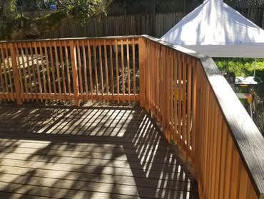 New Trex® deck with redwood picket railing