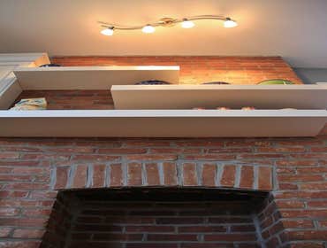 Elgin Street: Kitchen Remodel This warm and inviting kitchen features a variety of natural materials. From the existing brick, to the butcher block and