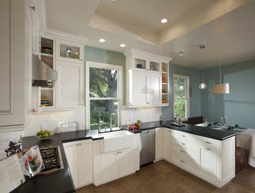 Colonial Kitchen Remodel - Saratoga, CA This full Colonial style kitchen remodel in Saratoga, CA featured: White cabinetry - A farm house sink - Wolf d
