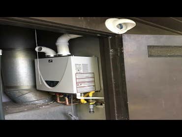Installed a tankless water heater works more efficiently atakes up less space