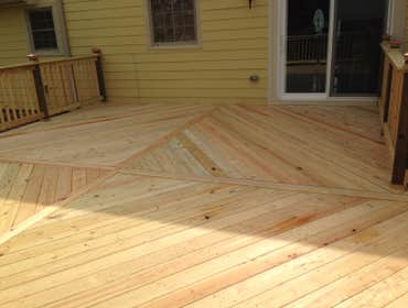 RESIDENTIAL EXTERIOR PROJECT Siding replacement and custom deck project.