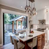 Kitchen with folding window & door in Woodinville, WA