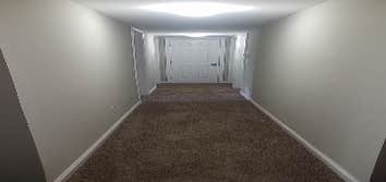 Photos by Combined Construction Services, Inc #1 Interior multi-family renovation including cabinets, countertops, flooring, paint, trim, and appliance