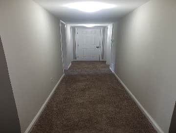 Photos by Combined Construction Services, Inc #1 Interior multi-family renovation including cabinets, countertops, flooring, paint, trim, and appliance