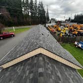 Complete exterior renovation in Oak Harbor, WA including removal of two existing layers of roofing shingles and installation of new Malarkey 30-year ar