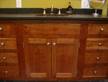 Bath Room Remodeling Custom Cherry wood Vanity Cabinet and Glass shower
A beautiful bathroom