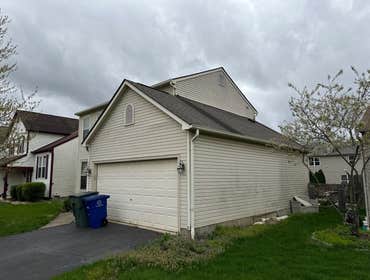 Photos by 614 Exteriors, LLC #28 Removed old siding, wood corners & window trim. Installed Provia 5" Dutch lap Sea Slate