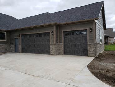 Photos by North Country Construction Inc #1 We built this gorgeous 5,000 SF house for a client in the powderhorn. It has a attached 3 car garage on a n