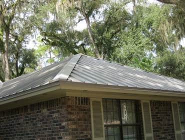 McKinney Residence Extensive remodel. Replacement of asphalt shingles roof included: Removal of shingles, re nail plywood decking, standing seam metal 