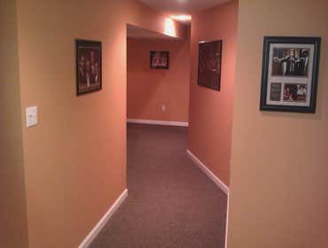 Hallway leading to gym & stair