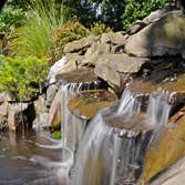 Scarsdale Waterfall by MG's Lawn Green Inc This is a waterfall that MG's Lawn Green designed and installed for a homeowner in Scarsdale, NY.