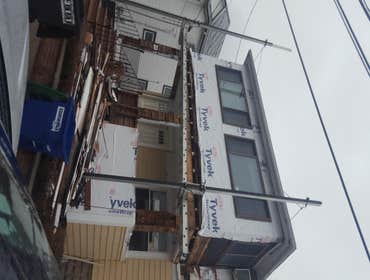 New exterior renovation removed old siding and trim, and installed Certianteed Cedar shakes, with all Certainteed pvc trim insulation board, tyvek hous