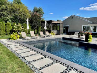 Backyard pool This outdoor project in Mountain View included a full backyard transformation with new concrete work, modern pavers, custom landscaping, 