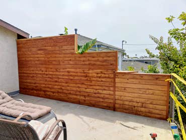 Custom Handrailing & Privacy wall to an existing deck. Redwood posts with an outdoor dinette style top cap wide enough for plates - horizontally placed