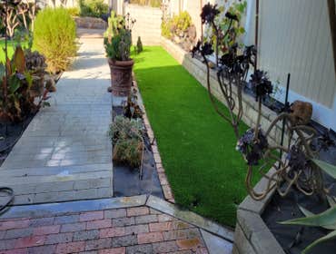 Photos by Jz Synthetic Products #3 Flagstone, with beautiful turf all around..
A great flagstone install with some high quality turf to add to its beau
