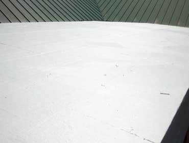 Photos from Fishers Country Store Tapered roof system on freezer. Conklin Benchply