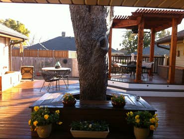 Custom composite deck with cedar arbor, amenities Custom Trex deck, multi level, with raised cedar arbor dining area, three cedar side planter boxes, b
