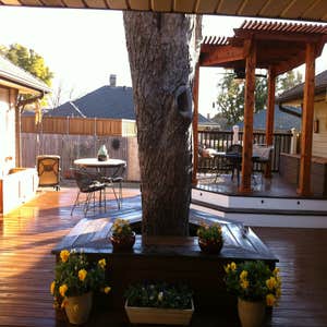 Custom composite deck with cedar arbor, amenities Custom Trex deck, multi level, with raised cedar arbor dining area, three cedar side planter...