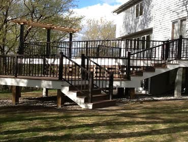 Photos by Custom Home Specialties Inc #2 Timber Tech maintenance free decks with powder coated railings.