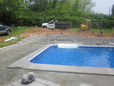 Photos by Dunn Landscape Construction #1 After initial pool installation provide all hardscape including retaining walls, pool deck, walkways and plant