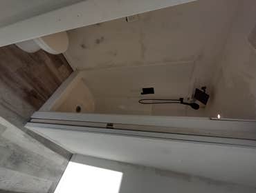 Photos by Stewart & Son Gate & Fence LLC #1 Tiny House with pergola. Small house 17' by 12' small bathroom with pocket door, and small sink with water 