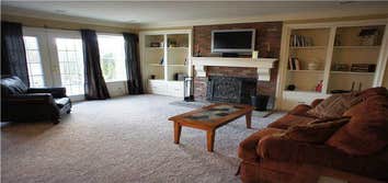 Built-in Book Cases, Delaware, OH Started with a plain wall. Added wood burning fireplace, mantel and custom built in book cases. Lower drawers pull 