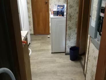 Photos by Eichmann Construction LLC #5 laundry room floor3 thresh holds and vent