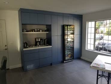 Modern Kitchen - Granada Hills Beautiful complete modern kitchen remodeling. Custom made a quarze countertop with waterfall edge detail. New tile backs