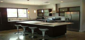 Petruzzello Kitchen New construction customer wanted a European look with their cabinetry. Notice the polished concrete floors.