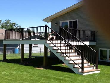 Photos by Custom Home Specialties Inc #2 Timber Tech maintenance free decks with powder coated railings.