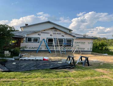 Photos by C.S Remodeling & Construction #1 Dust protection and entry to home protection temporary wall built to prevent anyone or anything from getting