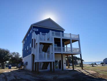 Photos by Future Homes #5 Two Story Beach Home on pilings with enclosed ground floor, 2 car garage, elevator