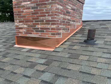 Photos by Tortora Home Improvement LLC #3 Removal of old roof. Installation of new Tamko Titan xt shingle roof and new copper flashing.