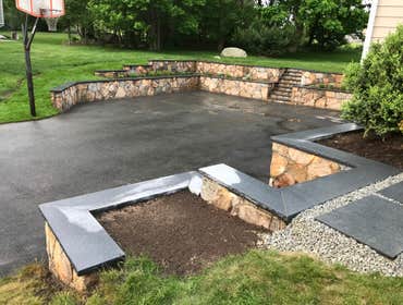 Photos by Stein Construction and Landscape Inc #1 Removal and dispose of old timber wall.
Installation of new natural fieldstone tiered retaining walls