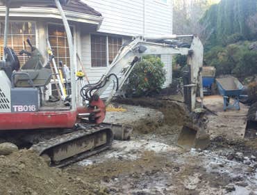 Excavating foundation footing