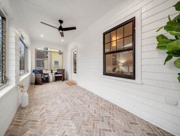 Photos by LCG BOSTON LLC #1 Full Home Remodel. Bathroom with custom glass, kitchen remodel with a beautiful exposed brick.