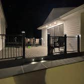 Photos by Jesse Fletcher Construction #4 24x40 deck. Half of the deck is a screened in room. Uplighting on the ceiling beams, recessed lighting and one