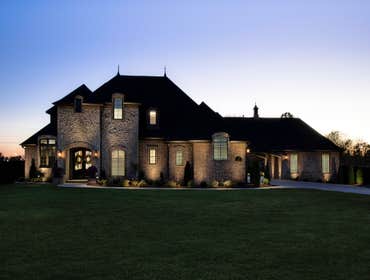 Ridgewood Custom Home This home has 4500 heated sq. ft. with 4 bedrooms, 4 1/2 baths, and a 4 car garage. The house boasts a theater room, game room,