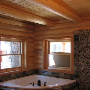 Custom Log Cabin Completed all construction tasks on custom log cabin besides log raising, including floor, roof, and interior wall framing. Separate t