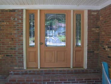 Photos by Cornerstone & Son Construction LLC #7 Installed pre-hung door with sidelights where 32" door was. Bricks were removed and replaced to accommo