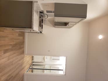 Garage to apartment conversion, added kitchenette, vinyl plank flooring, create bathroom, laundry room