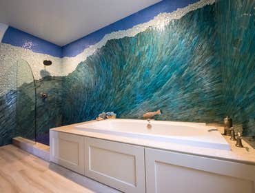 Nautical Residence Transformation of this 1950s one story home to a commanding 2 story outlook was remarkable. With its French Eclectic styling, this 