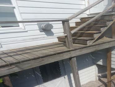 Deck replacement Knocked old porch and rebuild a foot wider and to code.