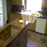 Othello Kitchen Granite/Porcelain Tile Work Kitchen Countertops and Backsplash done in Granite tile with hand beveled and polished edges and floors don