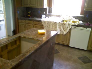 Othello Kitchen Granite/Porcelain Tile Work Kitchen Countertops and Backsplash done in Granite tile with hand beveled and polished edges and floors don
